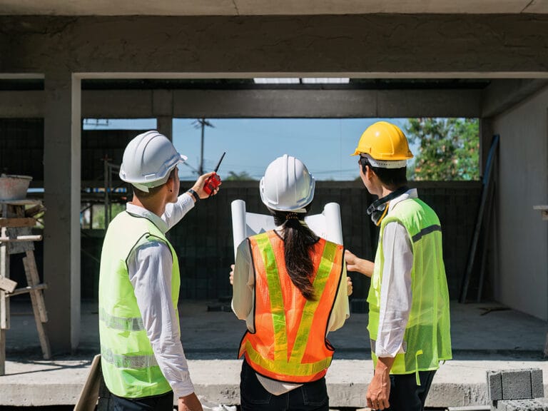 A high performance construction team assessing their latest project onsite
